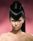 Topknot hairdo with a pointed fringe section