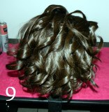 Top curls curled towards the back