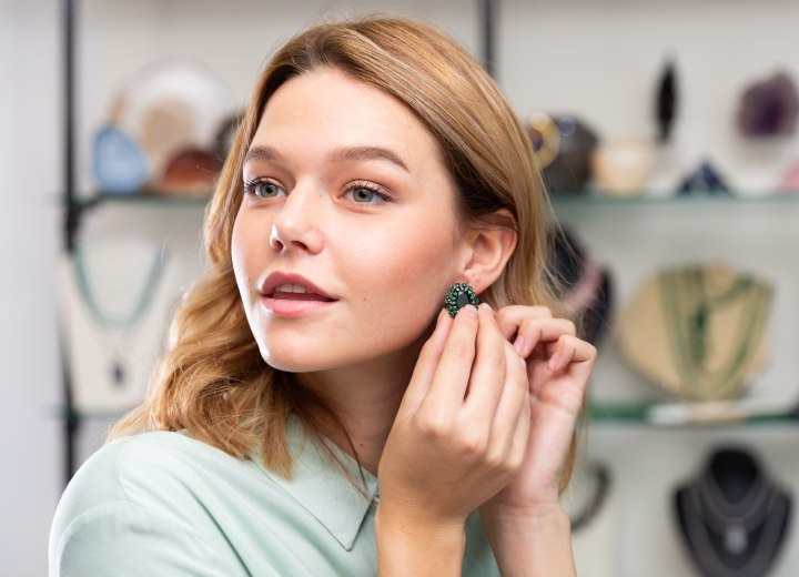 Trying on earrings