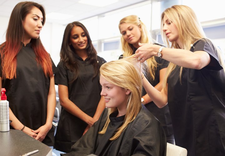 Hair school students learning hair cutting and styling