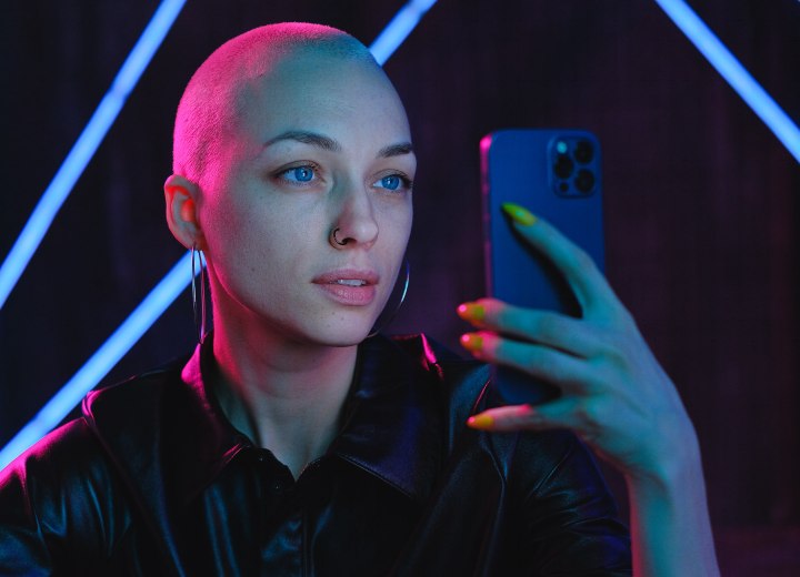 Bald girl, wearing leather