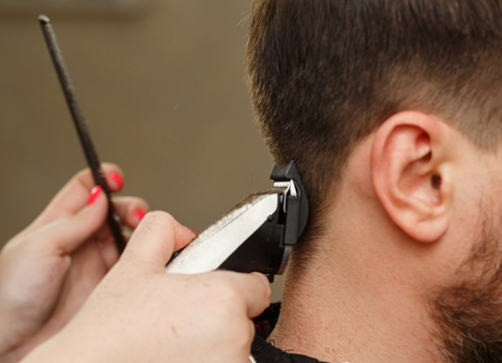 Clipper cutting hair