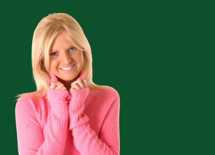 Blonde girl wearing a pink turtleneck sweater