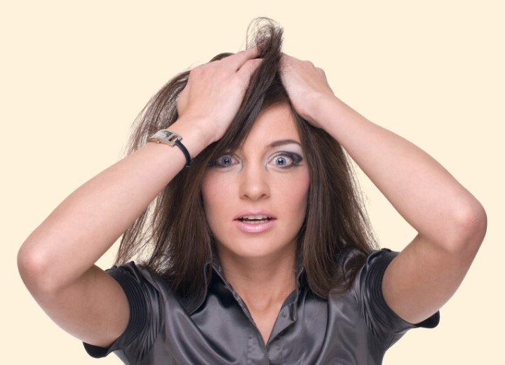 Woman worrying about her greasy hair