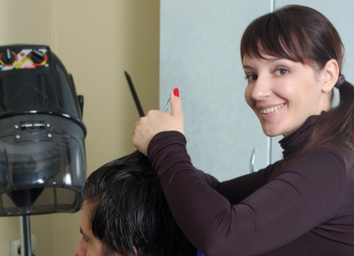 Hairdresser cutting hair