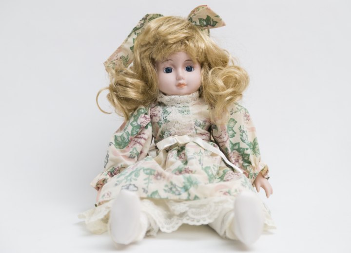 Porcelain doll with blonde hair