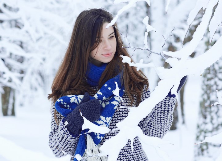 Woman with long hair, outside in the snow