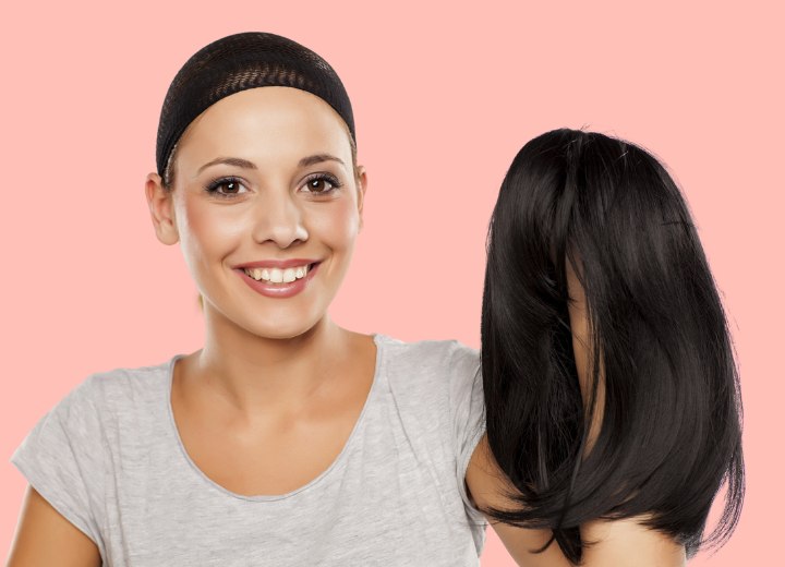 Woman just before putting on a wig