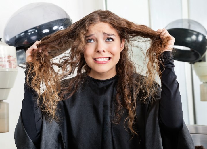 Girl with long hair and worried about an upcoming haircut