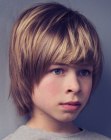 Medium length haircut with covered ears for boys
