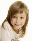 Soft razor cut hair with curved bangs for little girls