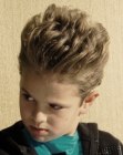 Little boys hairstyle with lifted top hair and gel styling
