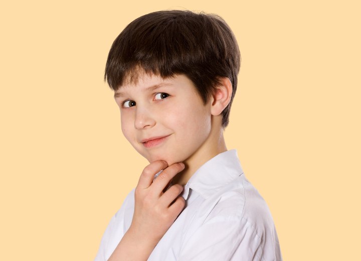 Little boys haircut with longer top hair and a fringe