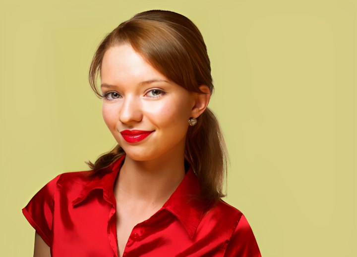 Young woman with red lip color and satin blouse