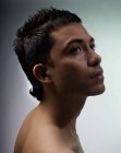 Short men's haircut with a longer neck section