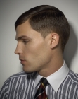 Masculine clipper cut hairstyle with the hair tapered closely around the ears