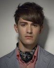 Layered hairstyle with heavy bangs for men