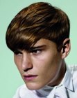 Fluid haircut with layers for guys