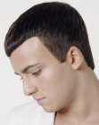 Men's haircut with neat lines and smooth styling