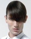 Man with pomaded hair and slick bangs