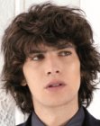 Hairstyle with long deconstructed curls for guys