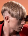 Male haircut with a buzzed neck and straight lengths