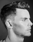 Men's hairstyle with shaven sides and longer top hair