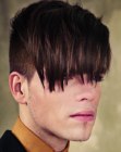 Boys hairstyle with extreme bangs