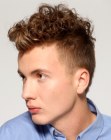 Hair with clipper cut sides and a curled crown