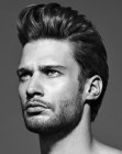 Gel styled men's hair with a high front