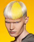 Bleached men's hair with yellow and blue color splashes