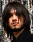 Long layered haircut with razor texturing for men