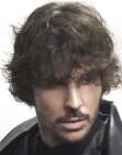 Men's hair with wet look curls