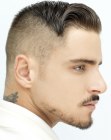 Men's hairdo with clipper cut sides and back