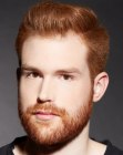 Masculine haircut and a full beard for red hair