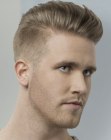 Male hairstyle with cropped sides and length on top