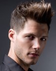 Male haircut with short sides and a retro quiff