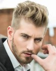 Men's haircut with neat sides and wavy top hair