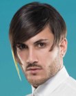 Extravagant male hairstyle with asymmetry