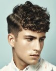 Male hairstyle with short sides and curls