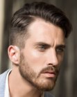 Sophisticated men's haircut with graduated sides