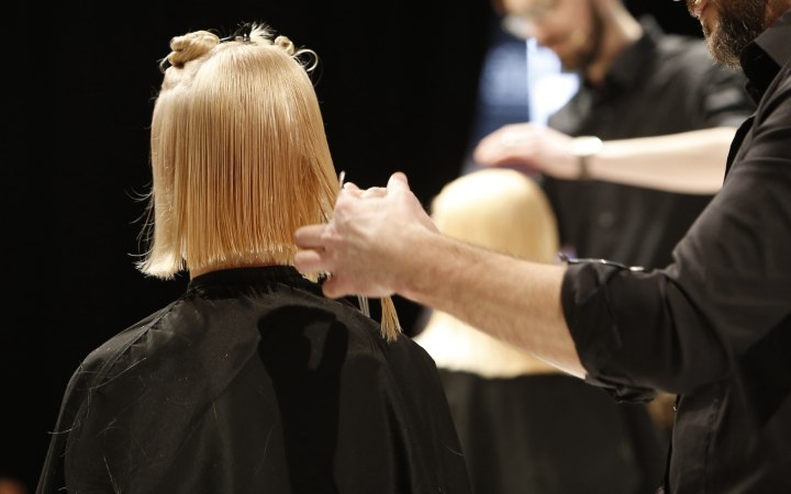 Back view of a bob cut in progress