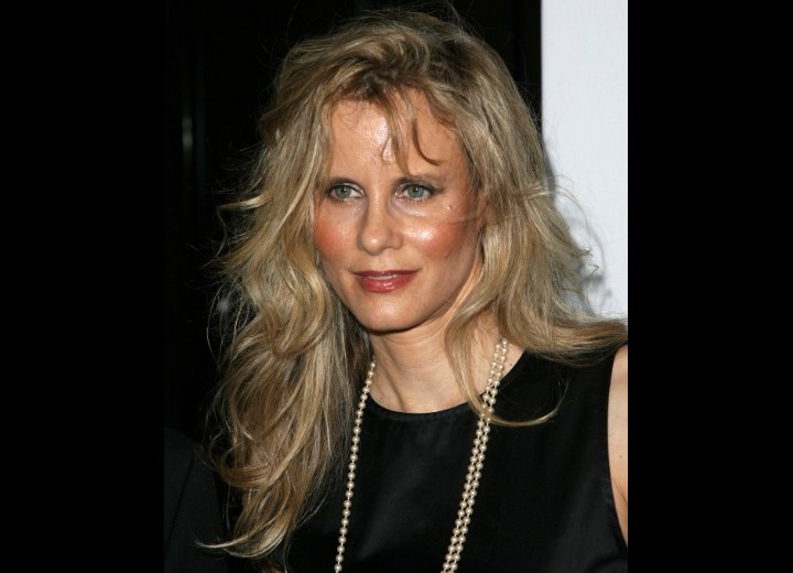 Lori Singer's long blonde hair with side bangs