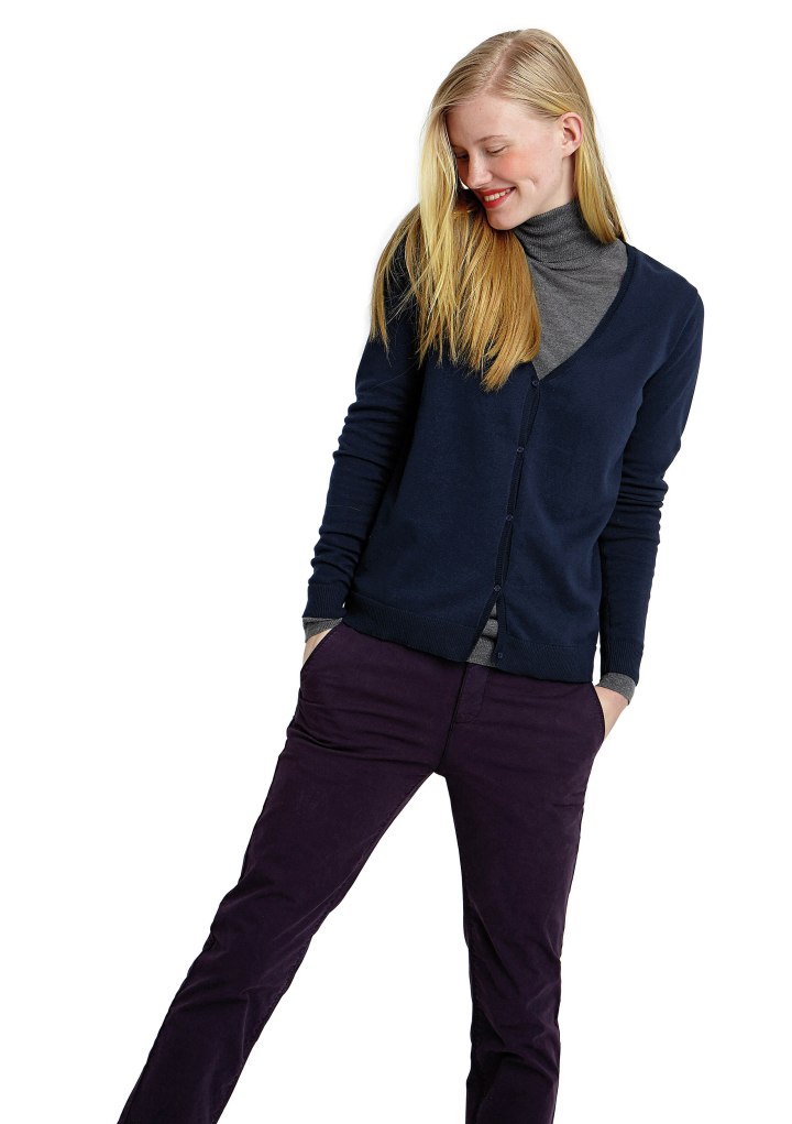Gray roll neck paired with a blue cardigan and purple trousers