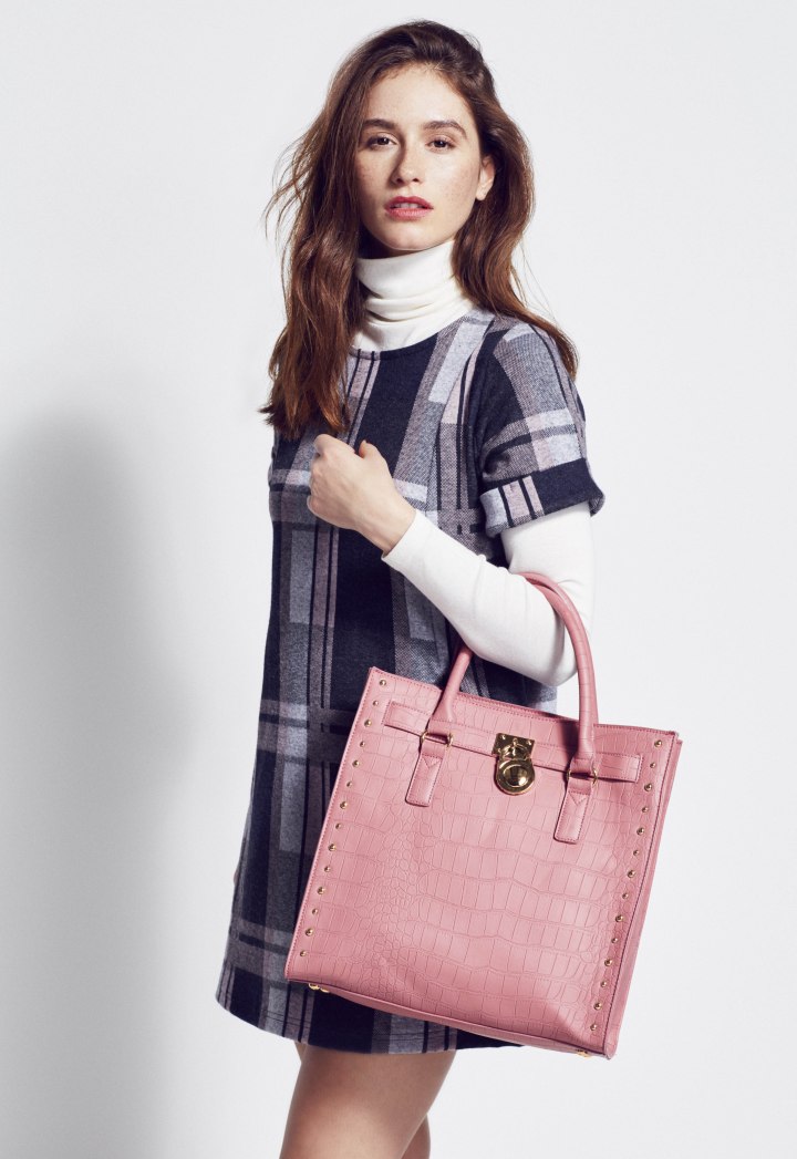 White turtleneck paired with a checked dress