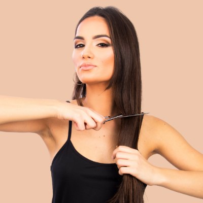 Woman who is chopping her long hair