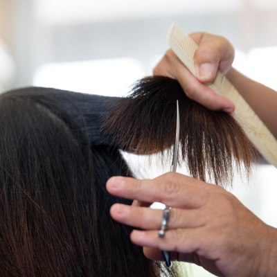 Cutting the hair of a bedridden person