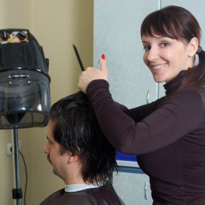Female hairdresser and male client