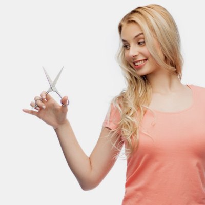 Woman with hair cutting shears