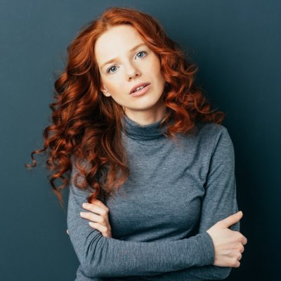 Redhead wearing a gray turtleneck